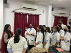 Students listening carefully to Yogita's guidelines